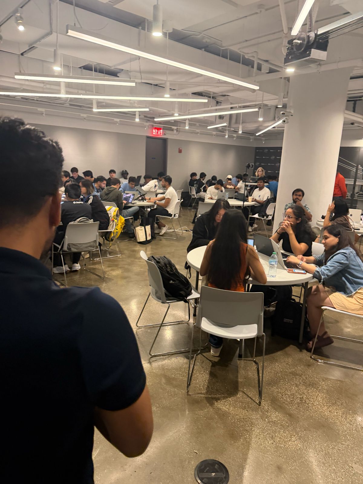 Hackathon teams working at tables
